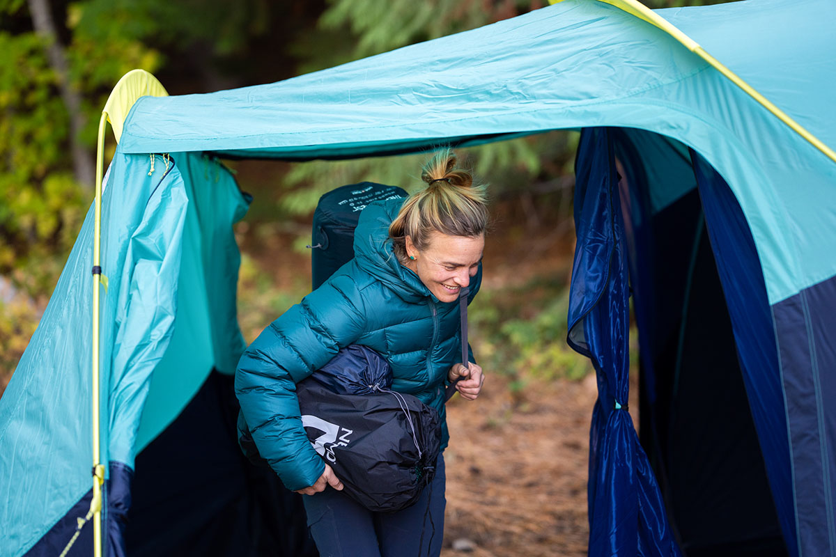 Women's down jacket (loading gear into tent in Outdoor Research Coldfront)